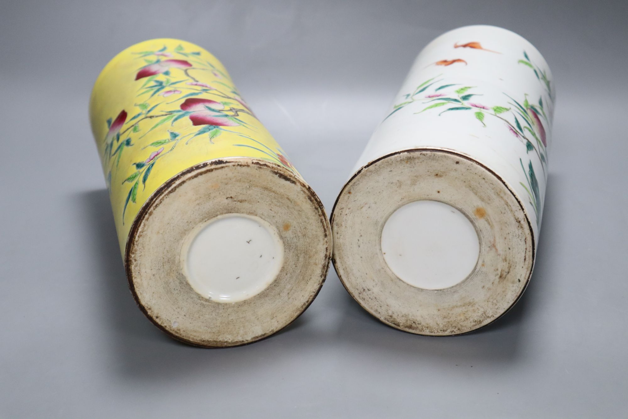 Two Chinese peaches and bats famille rose cylindrical vases, height 29cm